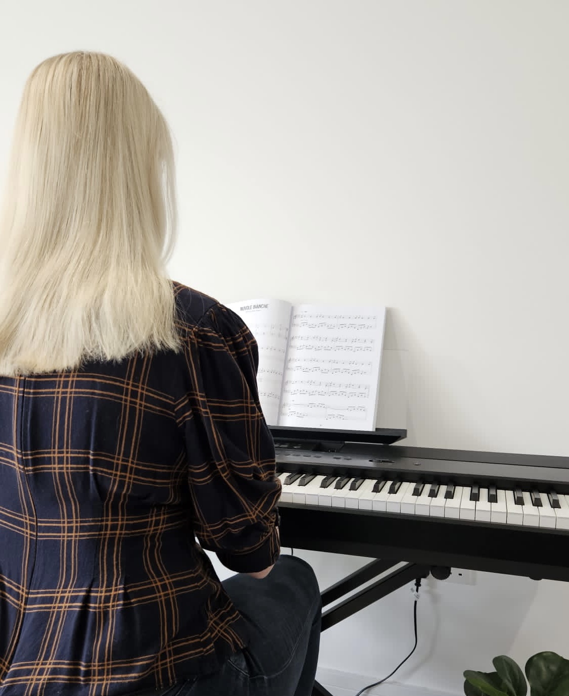 Hayley playing a digital piano